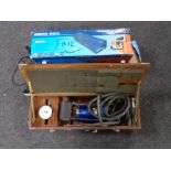 Two boxed surge protectors together with a cased tyre inflation foot pump.