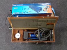 Two boxed surge protectors together with a cased tyre inflation foot pump.