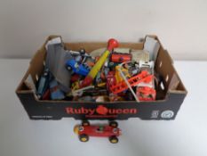 A box containing assorted die cast and plastic vehicles to include Triang Scalextric,