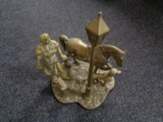 A heavy brass figure, blacksmith with horse.