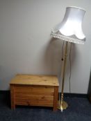 A brass standard lamp with shade together with a pine slatted blanket box.