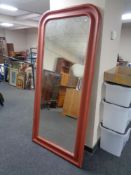 A contemporary painted framed arch topped mirror.