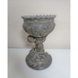 A 19th century embossed pot metal goblet with cherub support.