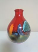 A Poole Pottery small bulbus vase, height 13cm.