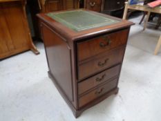 A mahogany two drawer filing chest with leather inset panel
