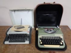 Two cased vintage typewriters, an Olympia Traveller De Luxe and an Imperial Good companion.