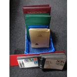 A quantity of First Day covers and albums containing stamps.