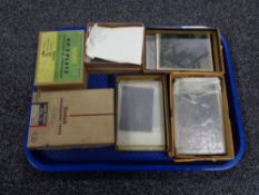 A tray containing vintage Ilford and Kodak photographic plates.