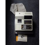 A Busicom NR-110 cash register.