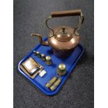 A tray of antique copper kettle, set of brass weights, miniature miner's lamps, two lighters.