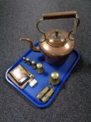 A tray of antique copper kettle, set of brass weights, miniature miner's lamps, two lighters.