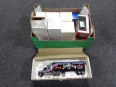 A box containing assorted die cast vehicles to include Corgi superhauliers match box models of