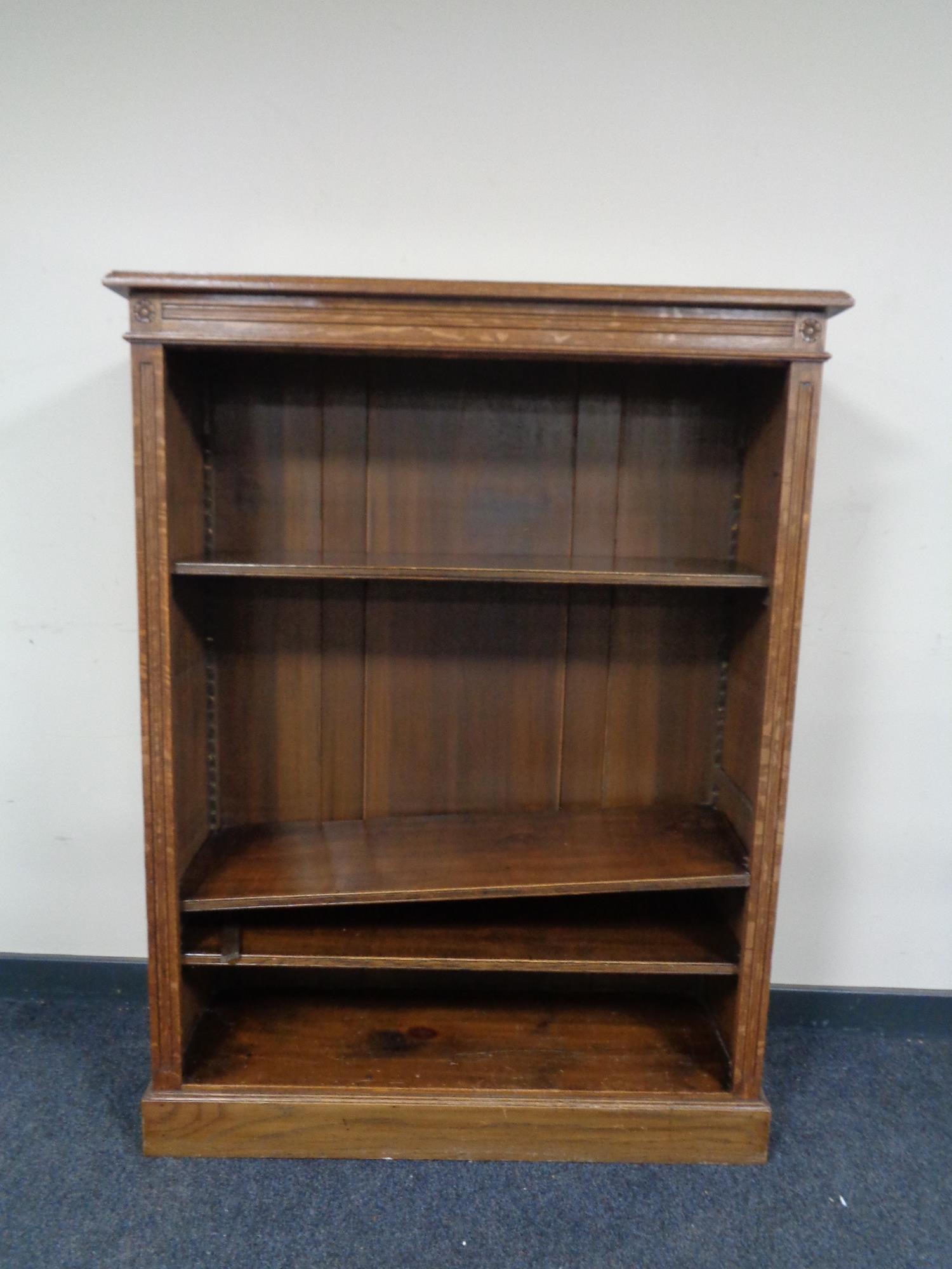 A set of oak Arts and Crafts open bookshelves.