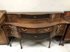 A George III style mahogany serpentine front sideboard,
