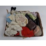 A box containing a beaded handbag, a cloth doll, leather wallet, dolls clothes etc.
