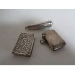 Two silver vesta cases together with a silver cigar case.