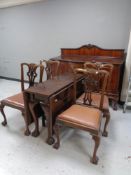 A 19th century six piece mahogany dining room suite comprising of serpentine front sideboard,