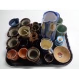 An interesting collection of twenty pieces of various late Twentieth Century studio pottery - mugs,