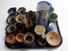 An interesting collection of twenty pieces of various late Twentieth Century studio pottery - mugs,