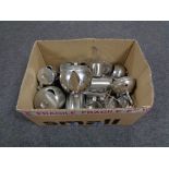 A box of stainless steel teapots, coffee pot,