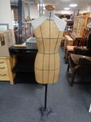 A mid 20th century dressmaker's dummy on metal stand.