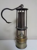 A vintage miner's lamp.