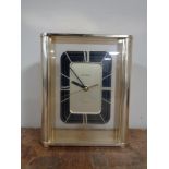 A Bulova quartz mantel clock.