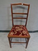 An antique mahogany bedroom chair