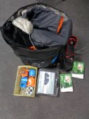 A large delivery bag containing Regatta rucksack, trainers, assorted clothing,