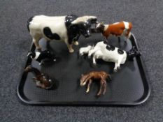 A tray containing six Beswick animal figures to include cows, foals, etc,