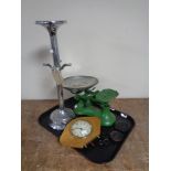 A tray containing kitchen scales with weights,