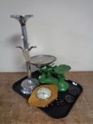 A tray containing kitchen scales with weights,