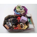 A tray containing a large quantity of costume jewellery to include faux coral necklaces,