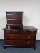 A Stag Minstrel six drawer chest together with two drawer bedside chest with slide.