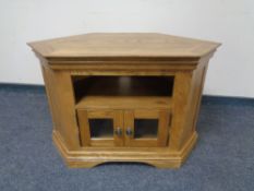 A shaped contemporary oak television stand.