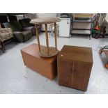 A walnut double door record cabinet together with a teak effect blanket box and an occasional table
