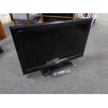 A Sony Bravia 32 inch LCD TV with lead and remote.