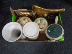 A box containing a chalk plaque of a caravan, two marble comports containing eggs, garden planters,