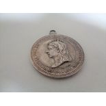 A Queen Victoria Silver Jubilee medal.