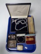 A tray of costume jewellery, necklaces, brooch, bracelets,