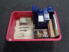 A box containing stamps relating to aviation, matchbooks, coin collecting cases and books.