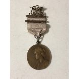 An early twentieth century East Lincolnshire musical medal on ribbon.