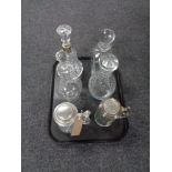 A tray containing four twentieth century decanters with stoppers together with two pewter lidded