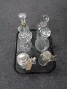 A tray containing four twentieth century decanters with stoppers together with two pewter lidded