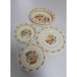 A Royal Doulton 'Bunnykins' shallow oval dish, together with a shallow circular dish and two plates.