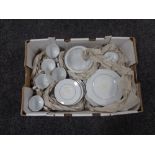 A box containing 26 pieces of Noritake white tea and dinner ware.