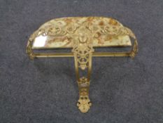 An ornate gilt metal wall mounted D shaped hall table with onyx top.