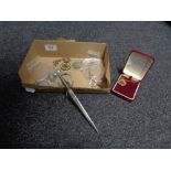 A box containing a Dutch coin bracelet, King George V medal, two enamel coins in silver mounts,