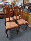 A set of four Edwardian Queen Anne style dining chairs.