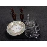 A tray containing a pair of Edwardian wooden candlesticks, a continental gilded china comport,